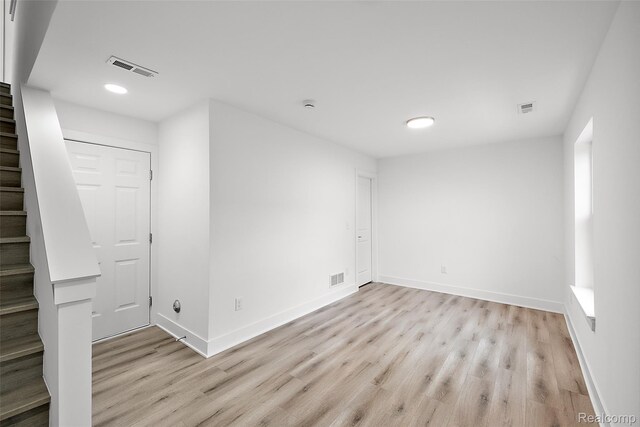 2817 Summers Pl, Troy, MI 48084 - below grade area with stairs, light wood-style floors, recessed lighting, and baseboards
