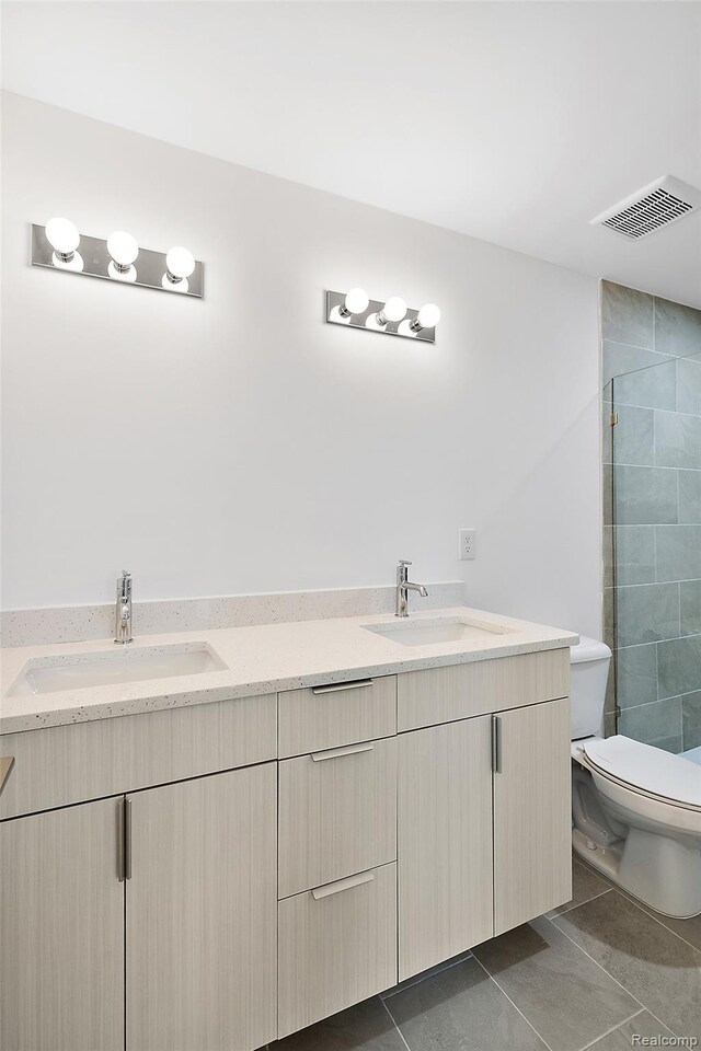 2817 Summers Pl, Troy, MI 48084 - bathroom with double vanity, a tile shower, toilet, and tile patterned flooring