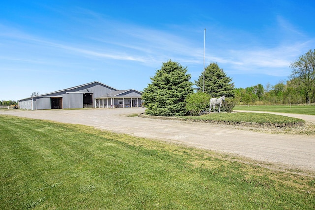 390 Iyopawa Rd, Coldwater, MI 49036 - view of front facade with a pole building, a front lawn, an outbuilding, and driveway