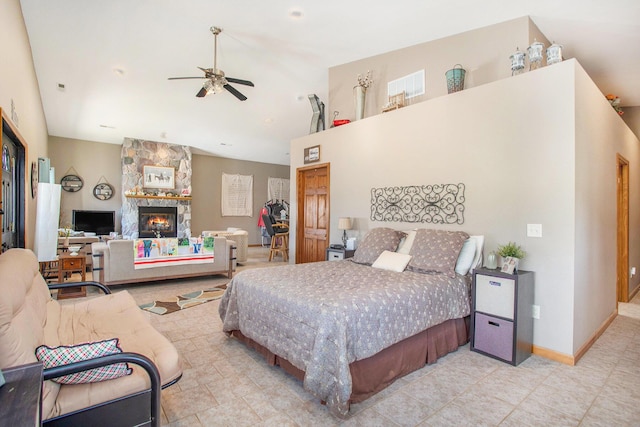 390 Iyopawa Rd, Coldwater, MI 49036 - tiled bedroom featuring a fireplace, ceiling fan, high vaulted ceiling, and baseboards