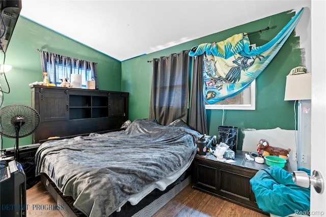7953 Elm St, Taylor, MI 48180 - bedroom with wood finished floors and lofted ceiling