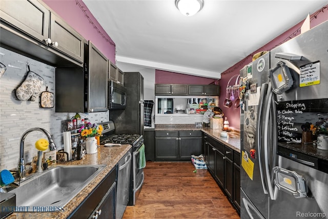 7953 Elm St, Taylor, MI 48180 - kitchen with stainless steel appliances, a sink, tasteful backsplash, lofted ceiling, and dark wood finished floors