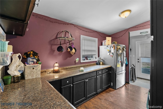 7953 Elm St, Taylor, MI 48180 - kitchen featuring freestanding refrigerator, wood finished floors, and dark stone counters