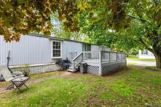 3723 Pinoak St, Clarkston, MI 48348 - rear view of property with a wooden deck and a yard