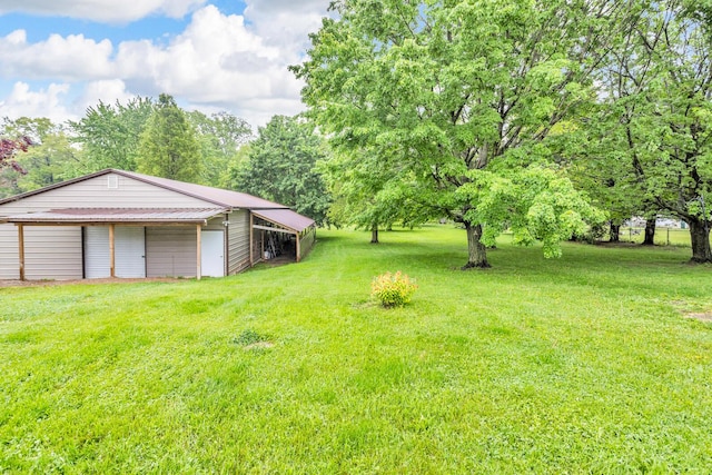 11245 Antcliff Rd, Brooklyn, MI 49230 - view of green lawn featuring a pole building, a detached garage, and an outbuilding