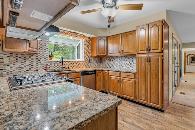 11245 Antcliff Rd, Brooklyn, MI 49230 - kitchen featuring dishwasher, light wood finished floors, a sink, brown cabinets, and stovetop