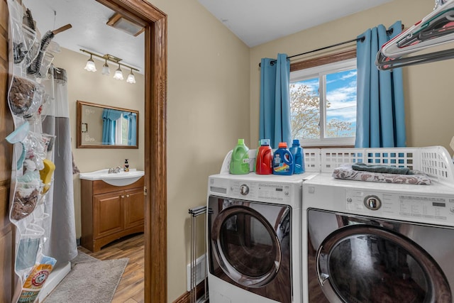 11245 Antcliff Rd, Brooklyn, MI 49230 - laundry area featuring washing machine and dryer and light wood-style floors