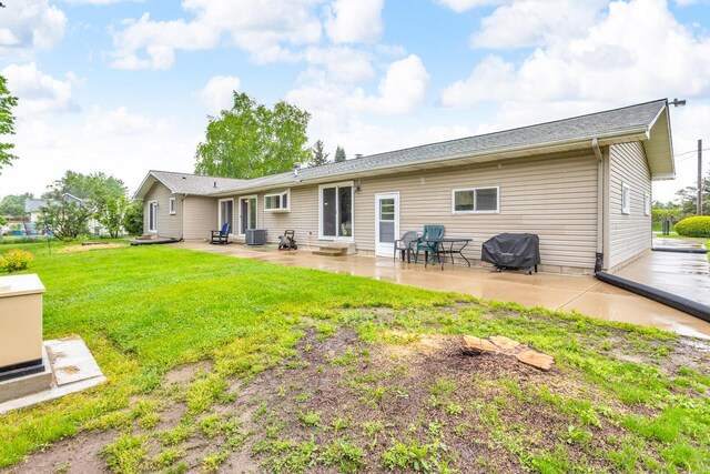 11245 Antcliff Rd, Brooklyn, MI 49230 - back of house with central air condition unit, a lawn, entry steps, and a patio