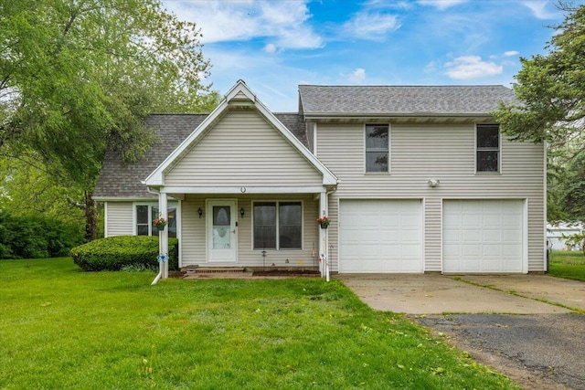 2875 Linco Rd, Berrien Springs, MI 49103 - view of front of home featuring a garage, driveway, a front yard, and a shingled roof