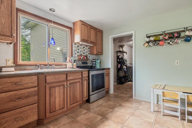 2875 Linco Rd, Berrien Springs, MI 49103 - kitchen featuring stainless steel electric range, a sink, brown cabinets, and light tile patterned flooring