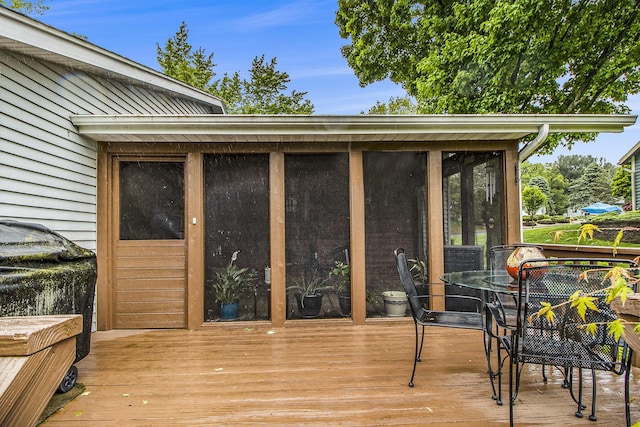 7289 Eagle Ter, Michigan, MI 49071 - deck with a sunroom and outdoor dining area