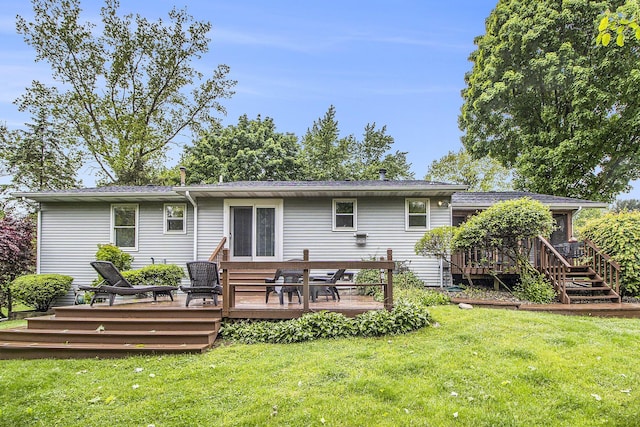 7289 Eagle Ter, Michigan, MI 49071 - rear view of property with a wooden deck and a lawn