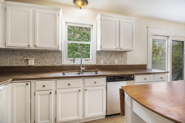 7289 Eagle Ter, Michigan, MI 49071 - kitchen featuring stainless steel dishwasher, a sink, dark countertops, and healthy amount of natural light