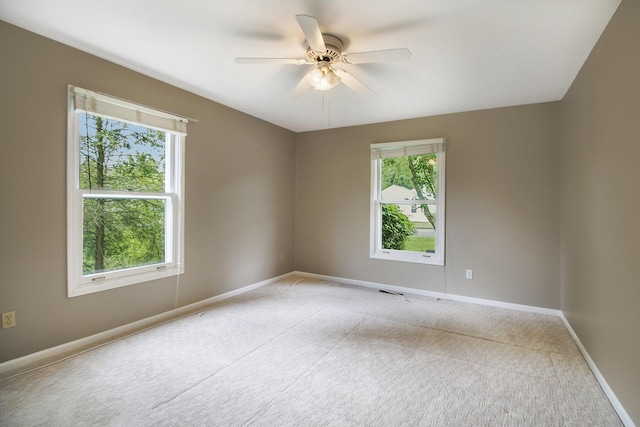 7289 Eagle Ter, Michigan, MI 49071 - empty room featuring plenty of natural light, light colored carpet, and a ceiling fan