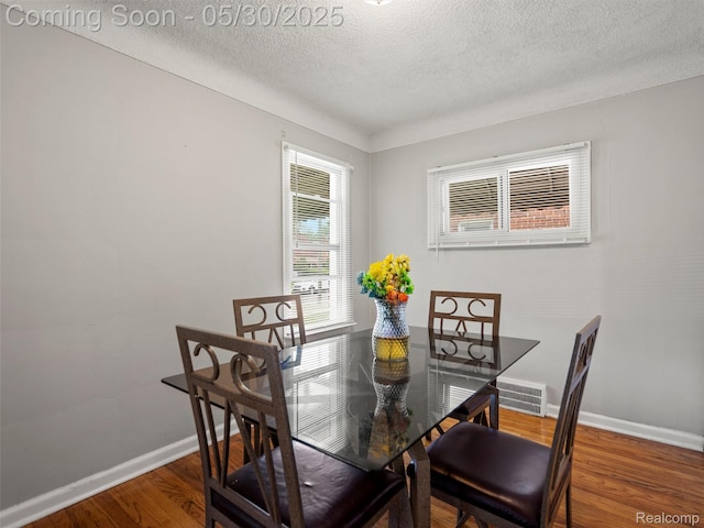 15058 Vaughan St, Detroit, MI 48223 - dining space with a textured ceiling, baseboards, and wood finished floors