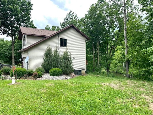 1720 Dimmers Rd, Reading, MI 49274 - view of home's exterior with a yard and central AC