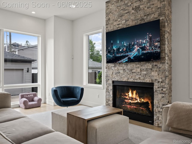 1622 Holland St, Birmingham, MI 48009 - living room with a stone fireplace, wood finished floors, healthy amount of natural light, and recessed lighting