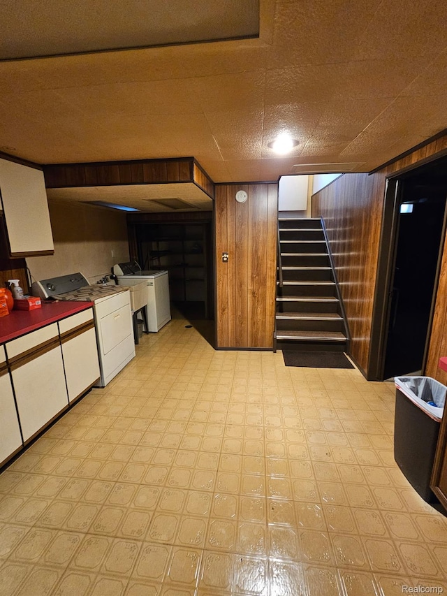 34245 Shawnee St, Westland, MI 48185 - finished below grade area featuring washer / clothes dryer, stairway, light floors, and wooden walls