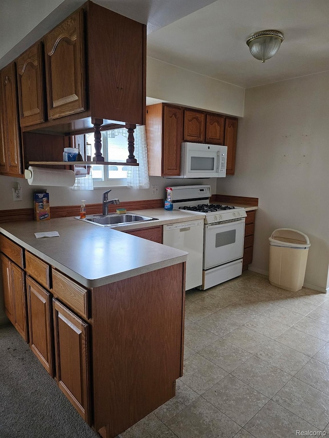 34245 Shawnee St, Westland, MI 48185 - kitchen with white appliances, a sink, a peninsula, and light countertops