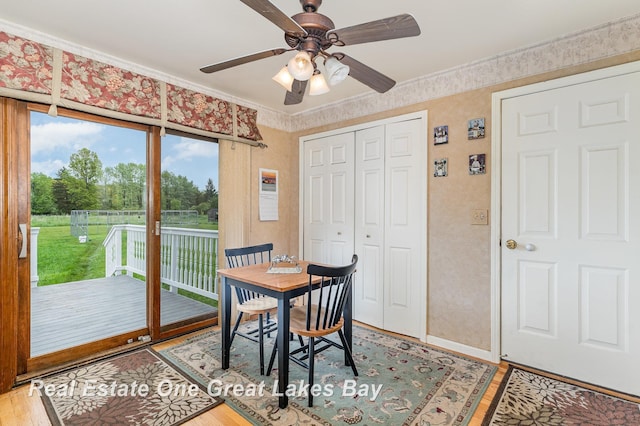 2203 Bullock Rd, Lapeer, MI 48446 - dining space featuring plenty of natural light, ceiling fan, light wood-type flooring, and ornamental molding