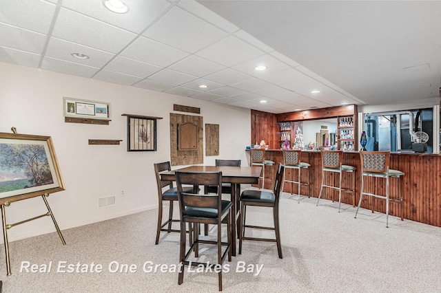2203 Bullock Rd, Lapeer, MI 48446 - dining area featuring carpet floors, bar area, recessed lighting, baseboards, and a paneled ceiling