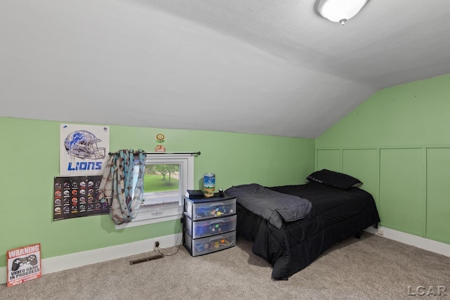 2803 Spielman Rd, Adrian, MI 49221 - carpeted bedroom featuring lofted ceiling and baseboards