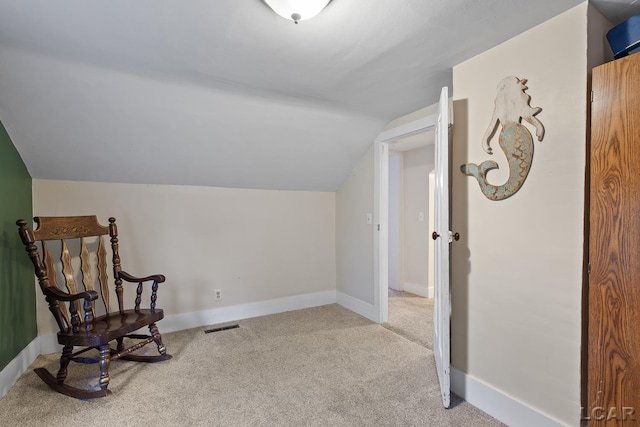 2803 Spielman Rd, Adrian, MI 49221 - sitting room featuring vaulted ceiling, carpet flooring, and baseboards