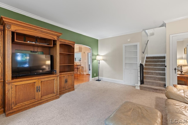 2803 Spielman Rd, Adrian, MI 49221 - living room with light carpet, ornamental molding, stairs, baseboards, and arched walkways