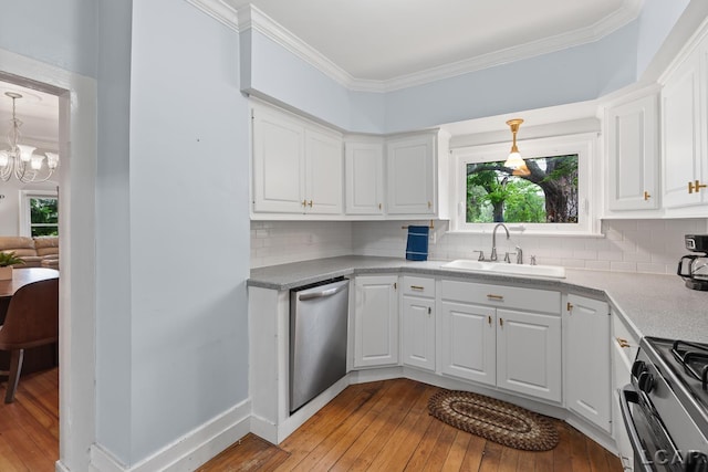 2803 Spielman Rd, Adrian, MI 49221 - kitchen featuring appliances with stainless steel finishes, a sink, light wood-style flooring, white cabinetry, and ornamental molding