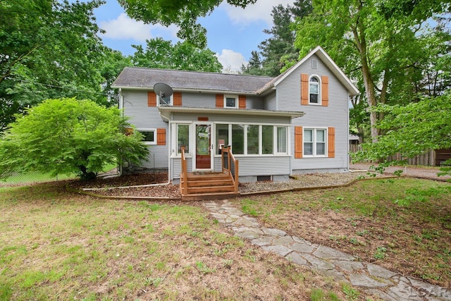 2803 Spielman Rd, Adrian, MI 49221 - traditional home featuring a sunroom, entry steps, and a front yard