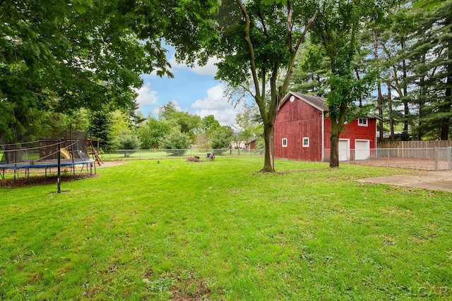 2803 Spielman Rd, Adrian, MI 49221 - view of yard with a trampoline and a detached garage