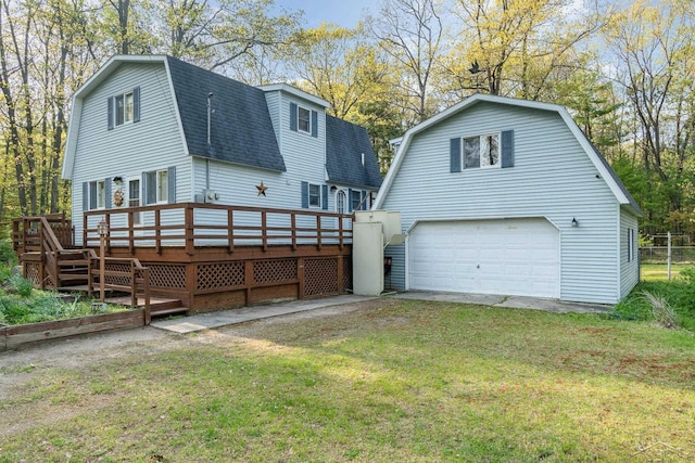 5295 E 14th St, Au Gres, MI 48703 - rear view of property with a gambrel roof, a shingled roof, a yard, and a wooden deck