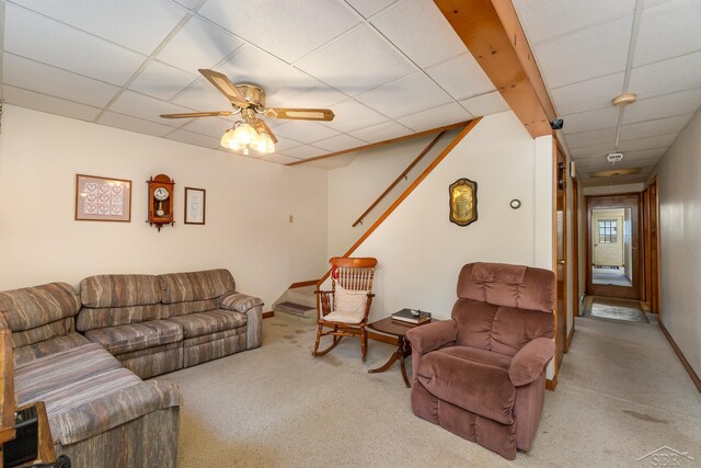 5295 E 14th St, Au Gres, MI 48703 - carpeted living area featuring a drop ceiling and a ceiling fan