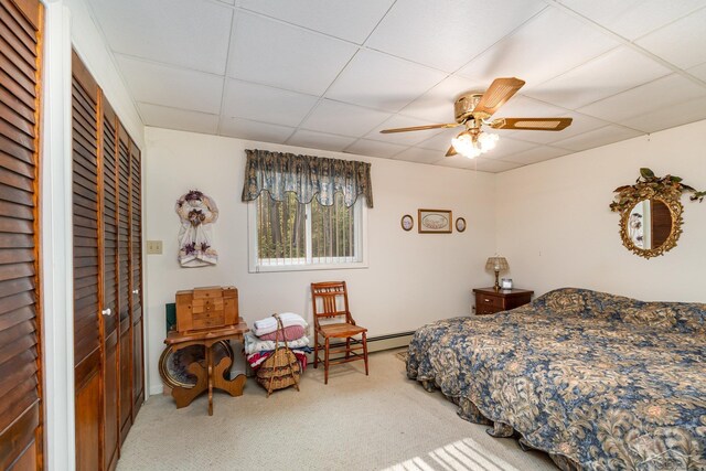 5295 E 14th St, Au Gres, MI 48703 - carpeted bedroom featuring a paneled ceiling, a ceiling fan, and a baseboard heating unit