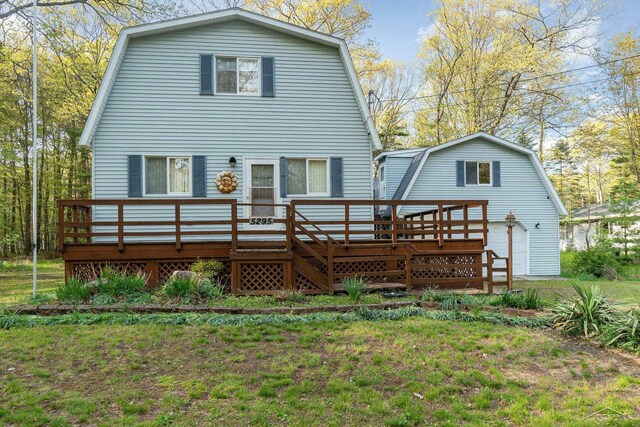 5295 E 14th St, Au Gres, MI 48703 - back of house with a gambrel roof and a deck