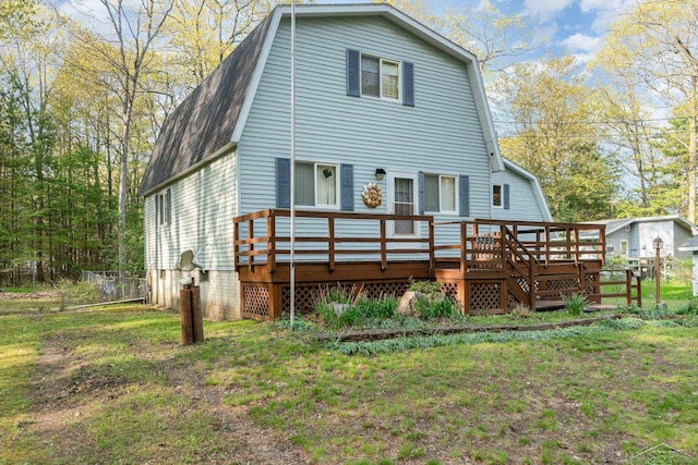 5295 E 14th St, Au Gres, MI 48703 - rear view of house with a gambrel roof, a wooden deck, and a shingled roof