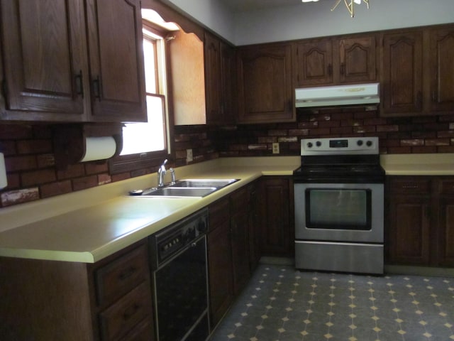 9303 County Road 653, Gobles, MI 49055 - kitchen with stainless steel electric range, under cabinet range hood, black dishwasher, a sink, and light countertops