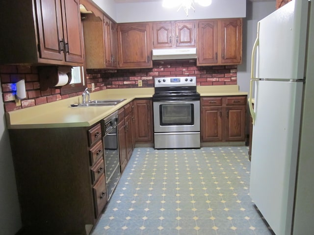 9303 County Road 653, Gobles, MI 49055 - kitchen featuring freestanding refrigerator, stainless steel range with electric stovetop, under cabinet range hood, a sink, and backsplash