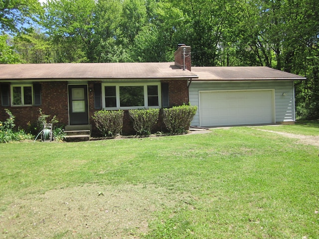 9303 County Road 653, Gobles, MI 49055 - ranch-style home featuring driveway, brick siding, a chimney, a front yard, and a garage