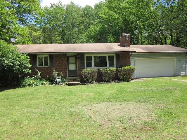 9303 County Road 653, Gobles, MI 49055 - single story home featuring a front yard, a garage, and brick siding