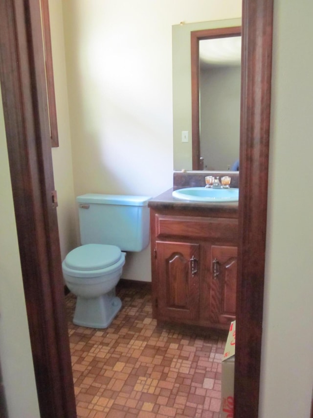 9303 County Road 653, Gobles, MI 49055 - half bathroom featuring vanity and toilet