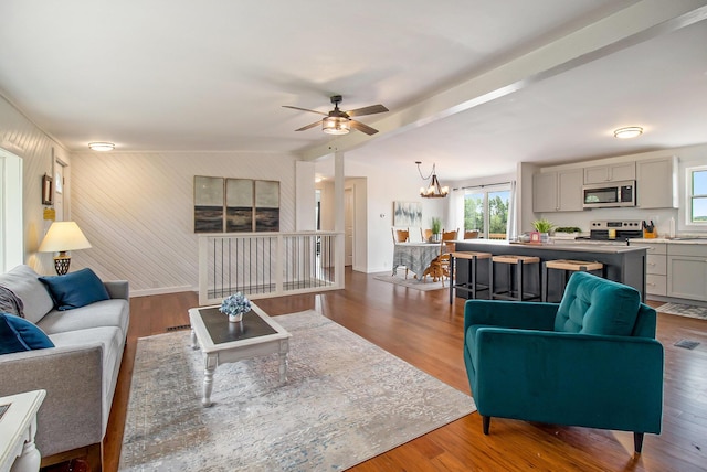 1981 E Wolf Rd, Hart, MI 49420 - living area featuring a ceiling fan, a chandelier, wood finished floors, and baseboards