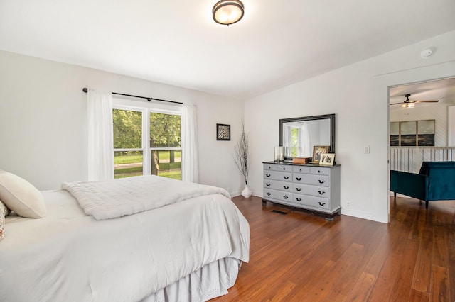 1981 E Wolf Rd, Hart, MI 49420 - bedroom with wood finished floors, vaulted ceiling, and baseboards