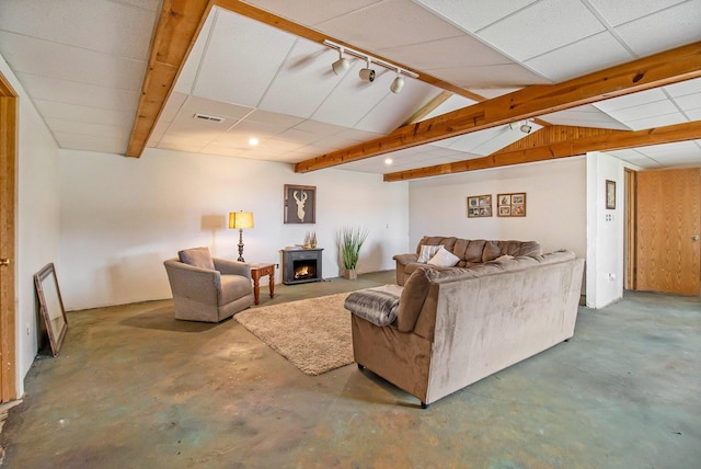 1981 E Wolf Rd, Hart, MI 49420 - living room with rail lighting, concrete flooring, and a lit fireplace