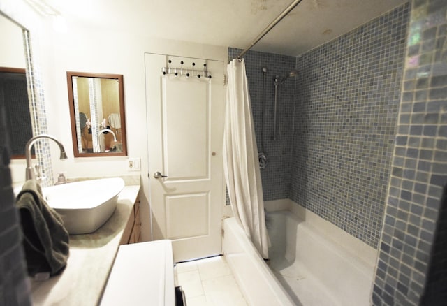 555 E William St Unit 5C, Ann Arbor, MI 48104 - bathroom with vanity, shower / bath combo with shower curtain, and tile patterned floors