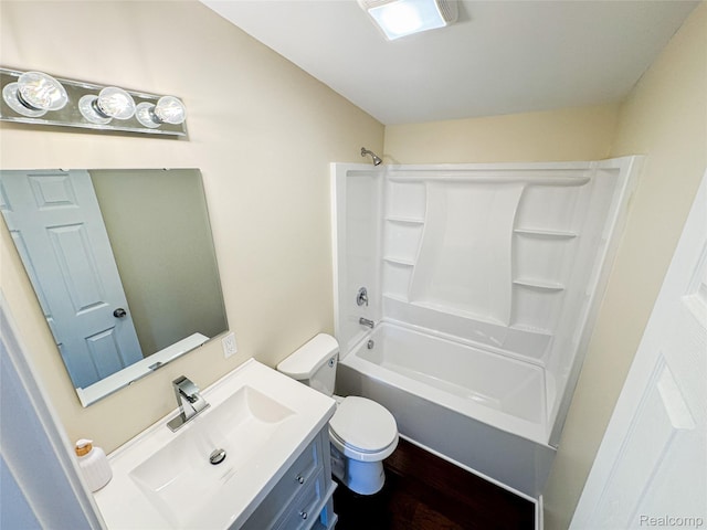 8909 E Country Ln, Lennon, MI 48449 - bathroom with toilet, vanity, wood finished floors, and shower / tub combination