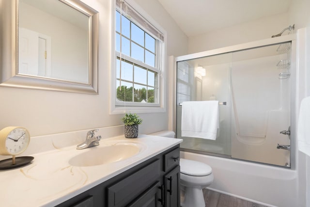 2441 Butterfly Ln, Berrien Springs, MI 49103 - full bath with vanity, shower / bath combination with glass door, toilet, and wood finished floors