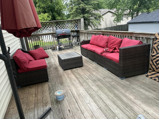 1300 Lancaster Ave NW, Grand Rapids, MI 49504 - deck with outdoor lounge area and a grill