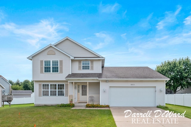 5512 Lillyview Ave SW, Wyoming, MI 49509 - view of front facade with a garage, concrete driveway, and a shingled roof