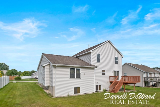 5512 Lillyview Ave SW, Wyoming, MI 49509 - rear view of property featuring a wooden deck, a shingled roof, and stairway